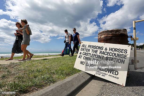 Warning sign sits the the entrance to the Castlepoint Beach Races on March 1, 2014 in Masterton, New Zealand.