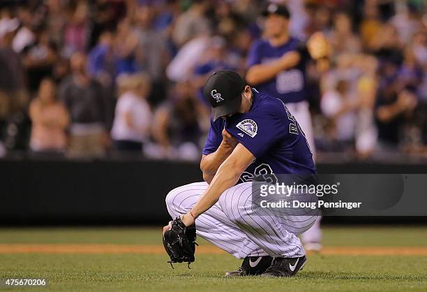 Rafael Betancourt of the Colorado Rockies reacts after giving up a grand slam home run to Alex Guerrero of the Los Angeles Dodgers to loose the game...