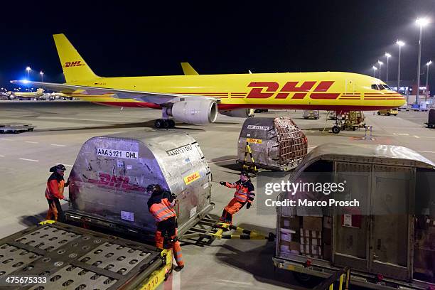 Cargo planes are unloaded at Halle-Leipzig Airport on February 28, 2014 in Leipzig, Germany. The soon to-be-expanded hub handles 2,000 tons of cargo,...