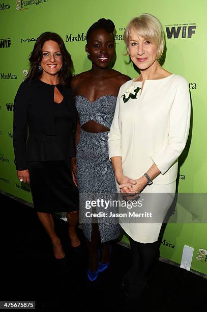 Producer Cathy Schulman, actress Lupita Nyong'o, and actress Helen Mirren attend the Women In Film Pre-Oscar Cocktail Party presented by...