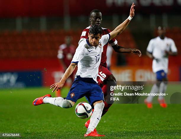 Ivo Rodrigues of Portugal shoots on goal in front of Serigne Abdou of Qatar during the FIFA U-20 World Cup New Zealand 2015 Group C match between...