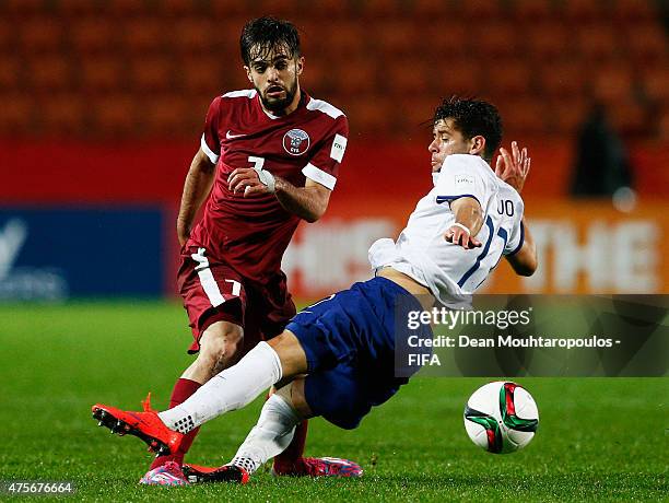 Ivo Rodrigues of Portugal tackles Jassim Al Jalabi of Qatar during the FIFA U-20 World Cup New Zealand 2015 Group C match between Qatar and Portugal...