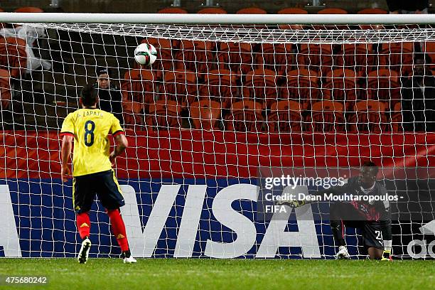 Goalkeeper, Ibrahima Sy of Senegal can only watch as Alexis Zapata of Colombia takes and scores a penalty during the FIFA U-20 World Cup New Zealand...