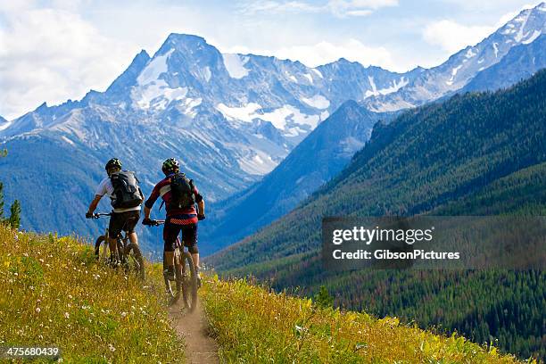 mountain biking british columbia - friends cycling stock pictures, royalty-free photos & images