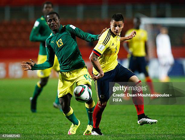 Alhassane Sylla of Senegal and Alexis Zapata of Colombia battle for the ball during the FIFA U-20 World Cup New Zealand 2015 Group C match between...
