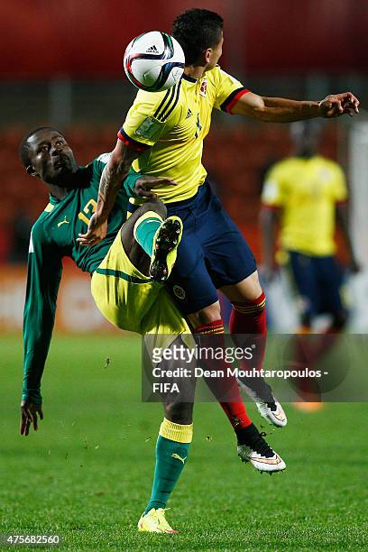 Alhassane Sylla of Senegal and Alexis Zapata of Colombia battle for the ball during the FIFA U-20 World Cup New Zealand 2015 Group C match between...
