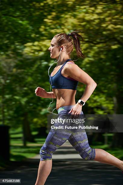 Portrait of a woman in sportswear running while modelling an Apple Watch Sport, taken on May 21, 2015.