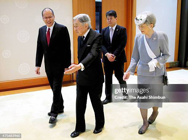 Philippine President Benigno Aquino is escorted by Emperor Akihito and Empress Michiko prior to their meeting at the Imperial Palace on June 3, 2015...