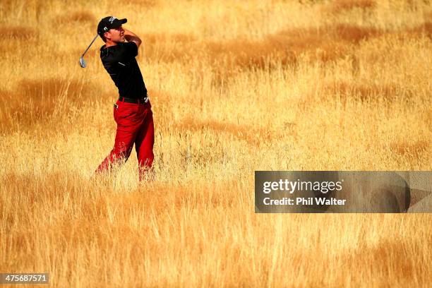 Matthew Perry of New Zealand plays out of the rough on the 14th hole during round three of the New Zealand Open at The Hills Golf Club on March 1,...