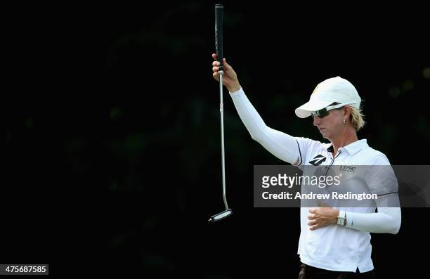 Karrie Webb of Australia lines up a putt on the first hole during the third round of the HSBC Women's Champions at the Sentosa Golf Club on March 1,...