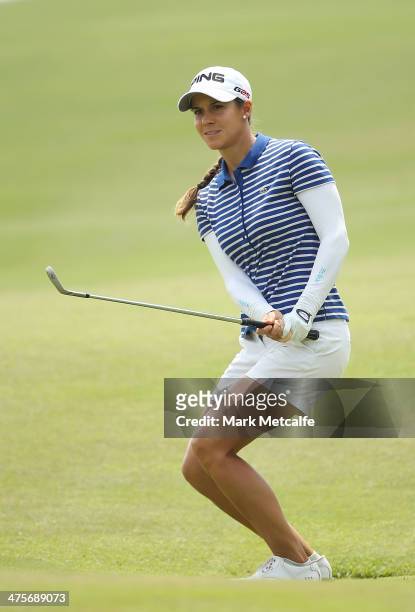 Azahara Munoz of Spain chips in for an eagle on the seventh hole during the third round of the HSBC Women's Champions at the Sentosa Golf Club on...