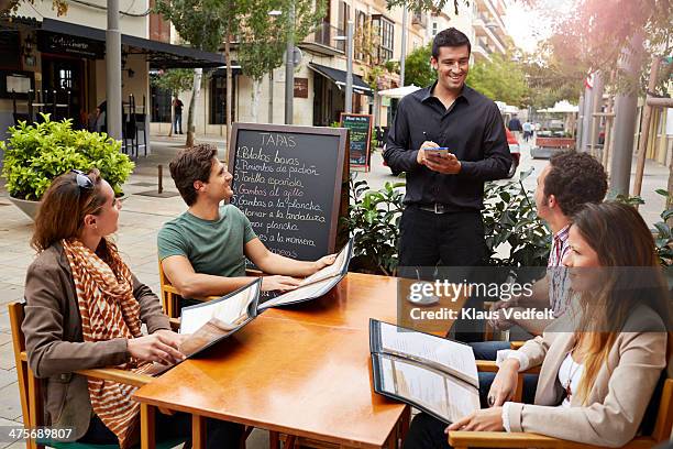 2 couples getting ready to order with waiter - man ordering stock pictures, royalty-free photos & images