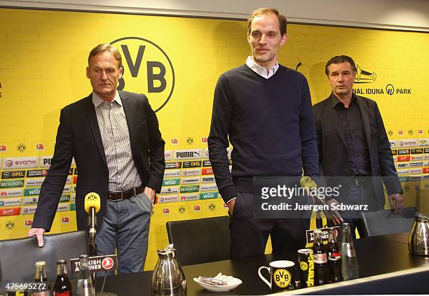 New headcoach of Borussia Dortmund Thomas Tuchel attends a news conference between CEO Hans-Joachim Watzke and sports director Michael Zorc at Signal...