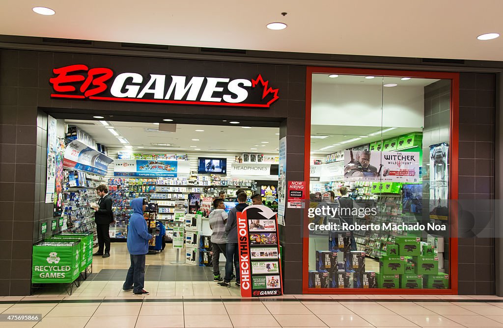 Customers browse games at EB Games in a shopping mall...