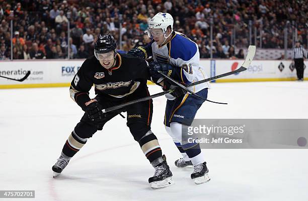 Mark Fistric of the Anaheim Ducks is checked by Vladimir Tarasenko of the St. Louis Blues in the second period at Honda Center on February 28, 2014...
