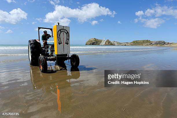 The finishing post is moved during the Castlepoint Beach Races on March 1, 2014 in Masterton, New Zealand.