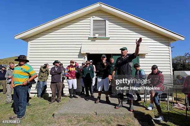 Riders and officials are briefed ahead of the Castlepoint Beach Races on March 1, 2014 in Masterton, New Zealand.