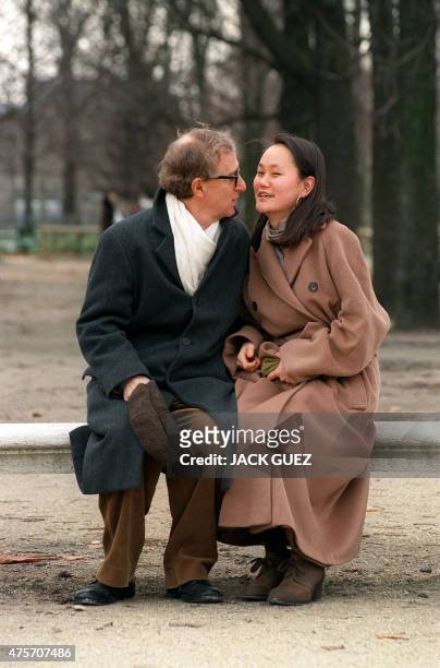 American actor and director Woody Allen kisses his wife Soon-Yi Previn, adopted daughter of his ex-wife Mia Farrow, 26 December 1997 in the Tuileries...