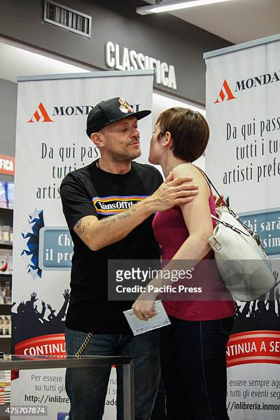 The Italian singer Max Pezzali , former leader of the group 883, greets his fan during his signing of copies of his latest album "Spaceship Max" to...