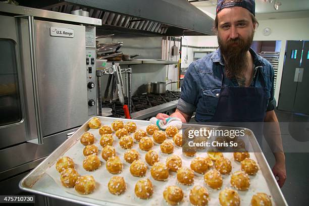 Tray full of chouquettes pulled fresh from the oven. French Chef Bertrand Alepee owner of the Tempered Room shows Sourced how he makes chouquettes.