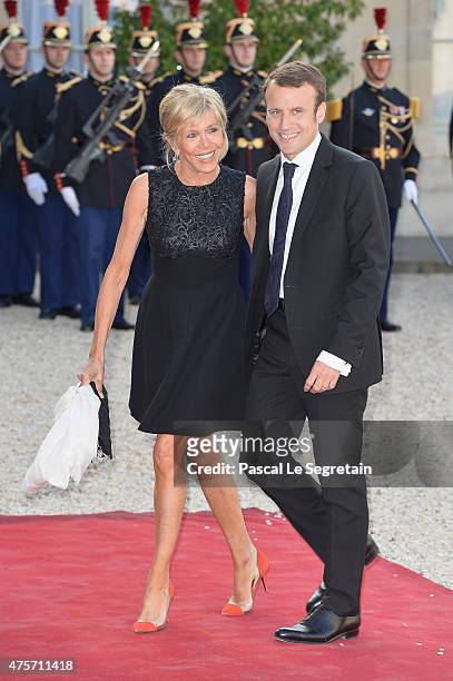 French Minister of Economy Emmanuel Macron and wife Brigitte Trogneux arrive for the State Dinner Offered By French President François Hollande at...