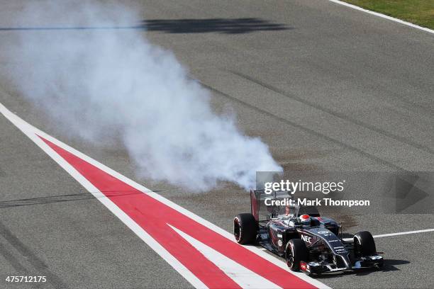 Adrian Sutil of Germany and Sauber F1 pulls into the pitlane with an engine fire during day three of Formula One Winter Testing at the Bahrain...