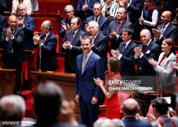 Spanish King Felipe VI and Queen Letizia receive applause after addressing the French parliament at the National Assembly in Paris on June 3, 2015....