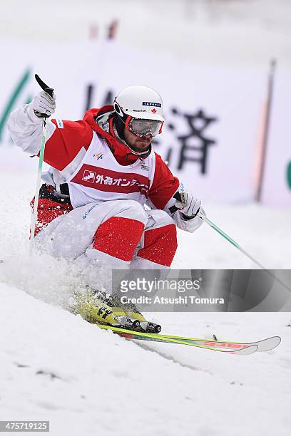 Philippe Marquis of Canada competes in the Men's Moguls final during the 2014 FIS Free Style Ski World Cup Inawashiro at Listel Inawashiro on March...