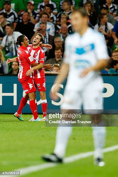 David Williams of the Heart congratulates team mate Mate Dugandzic on scoring during the round 21 A-League match between Melbourne Heart and...