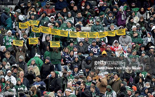 Angry New York Jets fans with FIRE IDZIK towels during the first half when the New York Jets played the New England Patriots Sunday, December 21,...