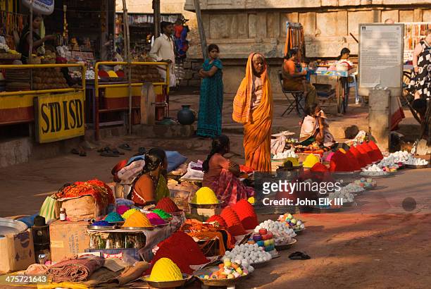 hampi bazaar, colored powder vendors - hampi fotografías e imágenes de stock