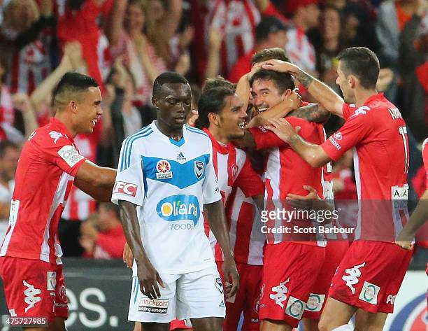 Harry Kewell of the Heart is congratulated by his teammates after scoring a goal during the round 21 A-League match between Melbourne Heart and...