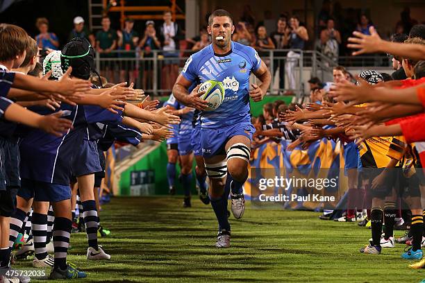 Matt Hodgson of the Force leads his team onto the field during the round three Super Rugby match between the Western Force and the ACT Brumbies at...