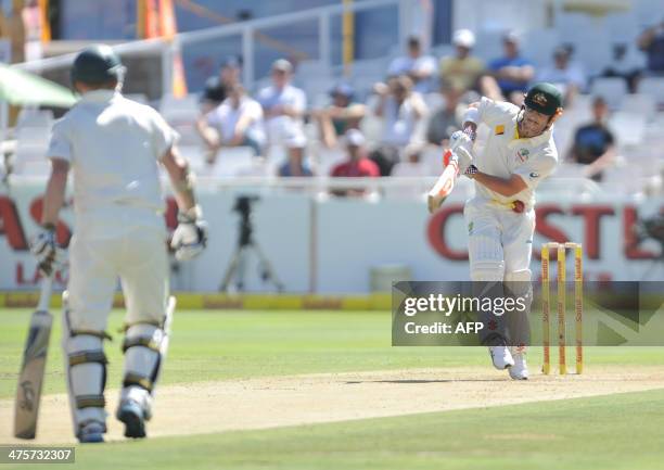 Batsman David Warner of Australia plays a shot on day 1 of the third test match between South Africa and Australia at Newlands stadium in Cape Town...