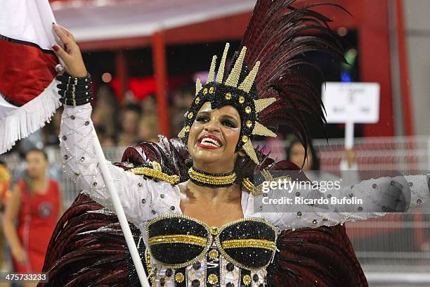 Member of the Dragoes da Real samba school performs during the first night of the Sao Paulo's Carnival parade at the Sambodromo on February 28, 2014...