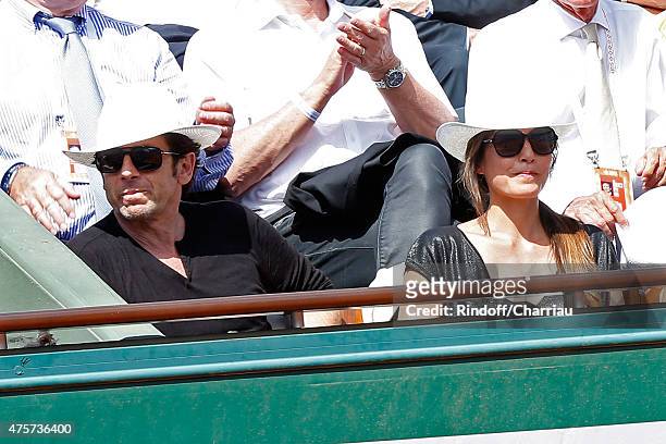 Singer Patrick Bruel and Caroline Nielsen attend the 2015 Roland Garros French Tennis Open - Day Eleven, on June 3, 2015 in Paris, France.