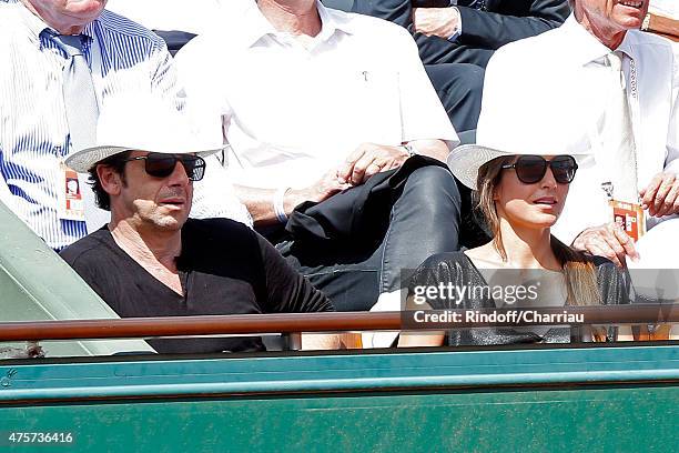 Singer Patrick Bruel and Caroline Nielsen attend the 2015 Roland Garros French Tennis Open - Day Eleven, on June 3, 2015 in Paris, France.