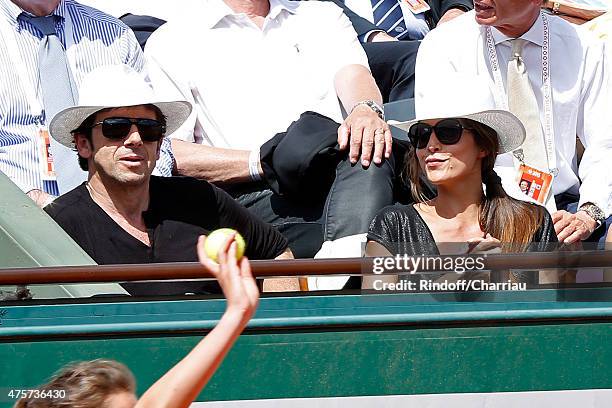 Singer Patrick Bruel and Caroline Nielsen attend the 2015 Roland Garros French Tennis Open - Day Eleven, on June 3, 2015 in Paris, France.