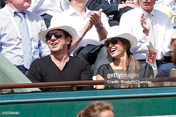 Singer Patrick Bruel and Caroline Nielsen attend the 2015 Roland Garros French Tennis Open - Day Eleven, on June 3, 2015 in Paris, France.