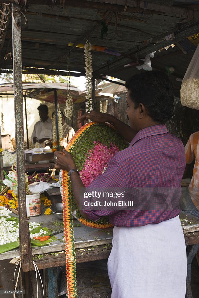 Man making flower arrangement