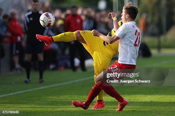 Dominik Franke of Leipzig tackles Felix Passlack of Dortmund during the B-Juniors Bundesliga Semi Final match between Borussia Dortmund and RB...