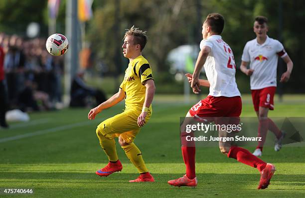 Dominik Franke of Leipzig tackles Felix Passlack of Dortmund during the B-Juniors Bundesliga Semi Final match between Borussia Dortmund and RB...