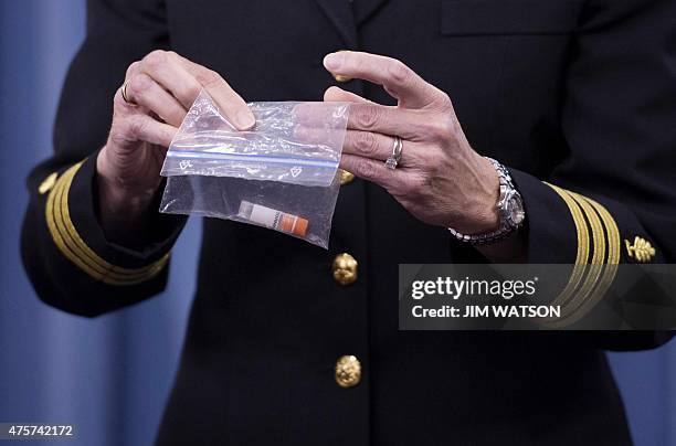 Director of Medical Programs for DoD Chemical and Biological Defense Commander Franca Jones demonstrates how Anthrax is shipped to labs during a...