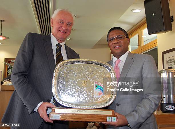 Cricket Australia Chairman Wally Edwards receives a plaque from the Minister of Sport and Recreation Mr Fikile Mbalula during day 1 of the 3rd Test...