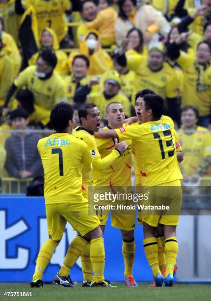 Masato Kudo of Kashiwa Reysol celebrates scoring his team's first goal with his teammates during the J. League match between Kashiwa Reysol and FC...