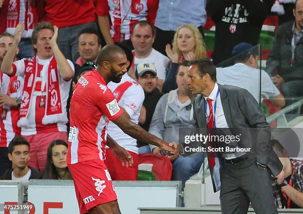 Orlando Engelaar of the Heart shakes hands with Heart coach John van't Schip as he is substituted during the round 21 A-League match between...