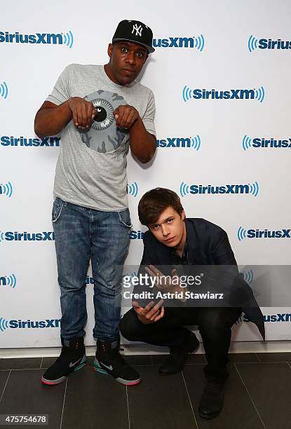 Sirius XM host DJ Whoo Kid and actor Nick Robinson pose for photos at the SiriusXM Studios on June 3, 2015 in New York City.