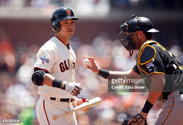 Nori Aoki of the San Francisco Giants is tagged out by Francisco Cervelli of the Pittsburgh Pirates after he struck out in the first inning at AT&T...
