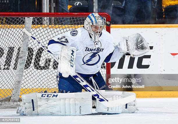 Kristers Gudlevskis of the Tampa Bay Lightning warm-ups prior to the game against the Nashville Predators at Bridgestone Arena on February 27, 2014...