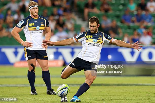 Nic White of the Brumbies takes conversion kick as David Pocock looks on during the round three Super Rugby match between the Western Force and the...